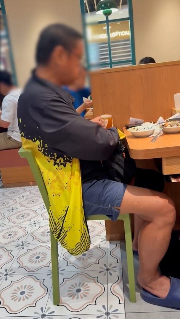 影片顯示，涉事阿叔疑正在餐廳內飲自攜啤酒。（Threads影片截圖／hobbitsharon）