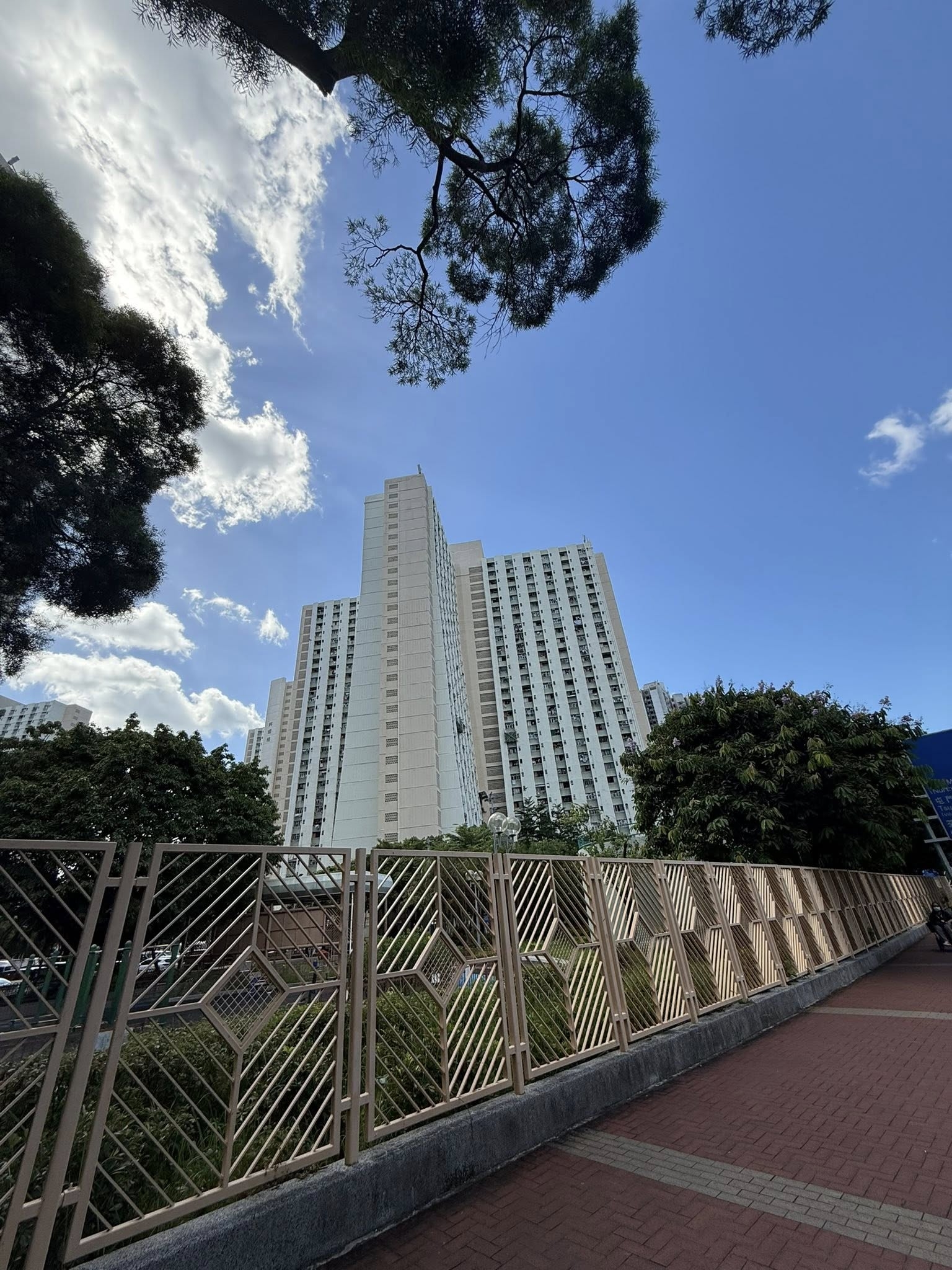 May be an image of cloud, bell tower and skyscraper