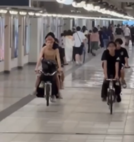 紅磡站隧道內「後生街車黨」踩單車大聲放音樂　網民意見不一