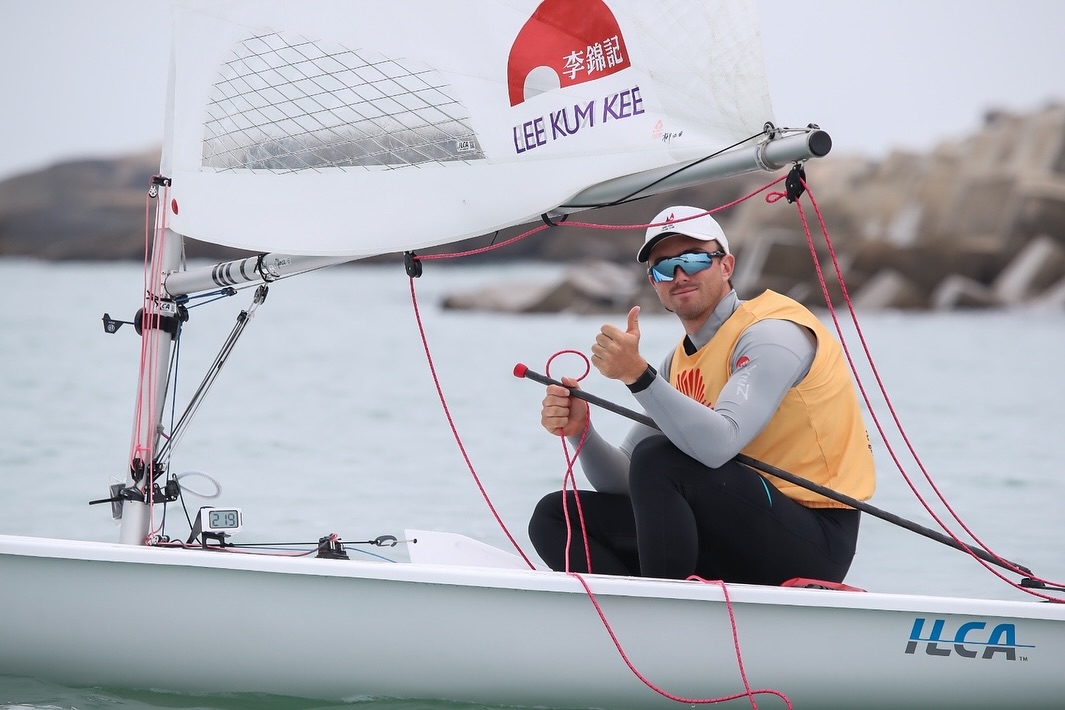 May be an image of ‎boat racing, sail, sailboat, kayak and ‎text that says '‎년 李錦記 LEEKUMKEE م LEE KИM KEE תמבוב ILCA‎'‎‎