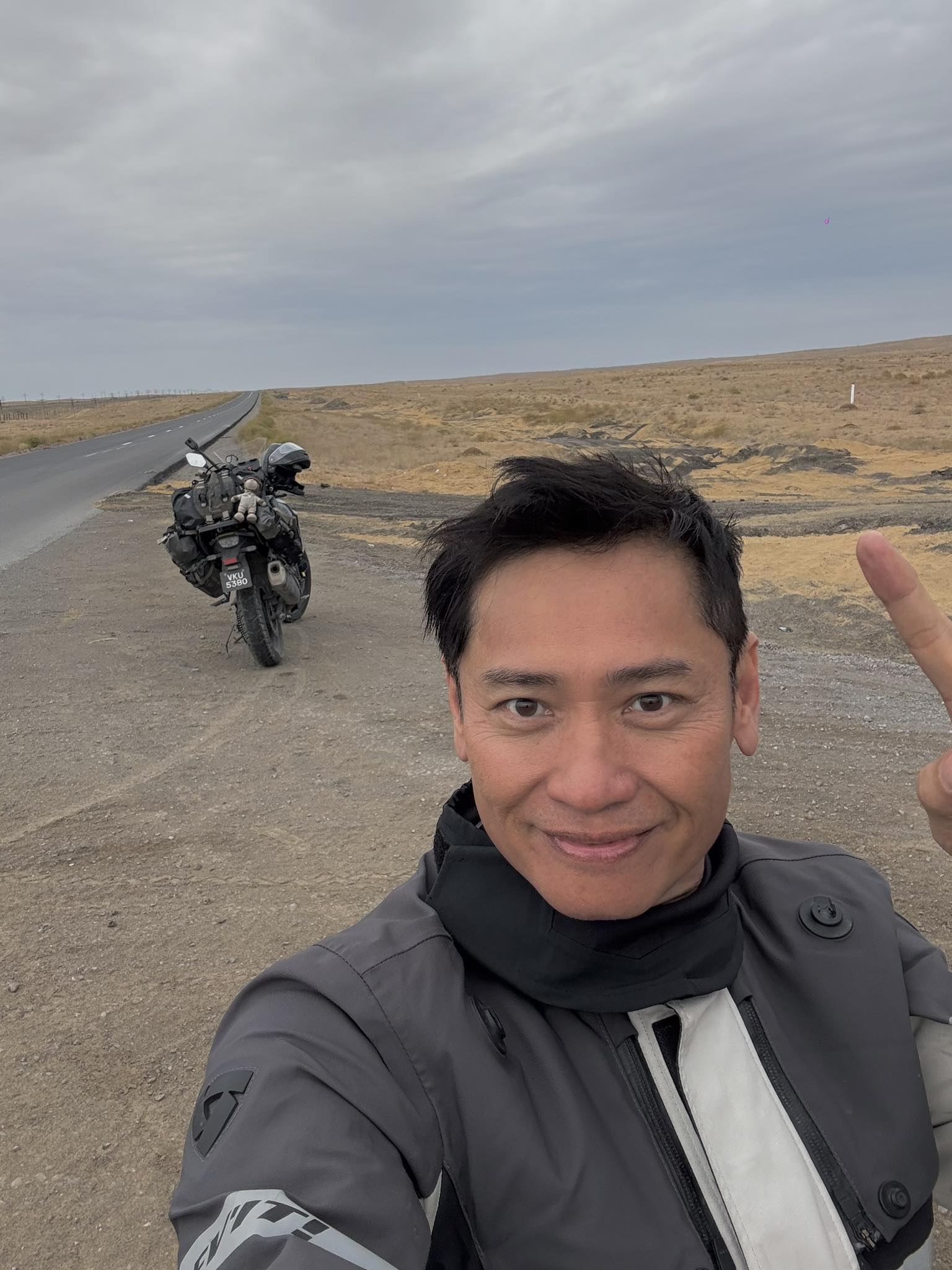 May be an image of 1 person, motorcycle and road