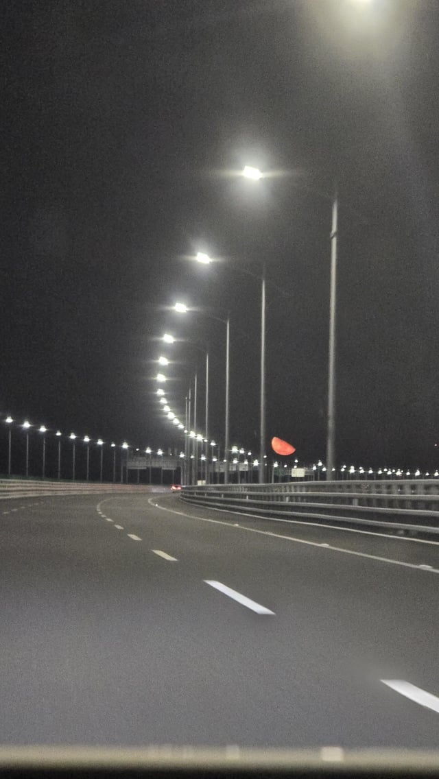 r/astrophotography - Blood moon from the Hong Kong-Zhuhai-Macau Bridge,the longest sea crossing in the world