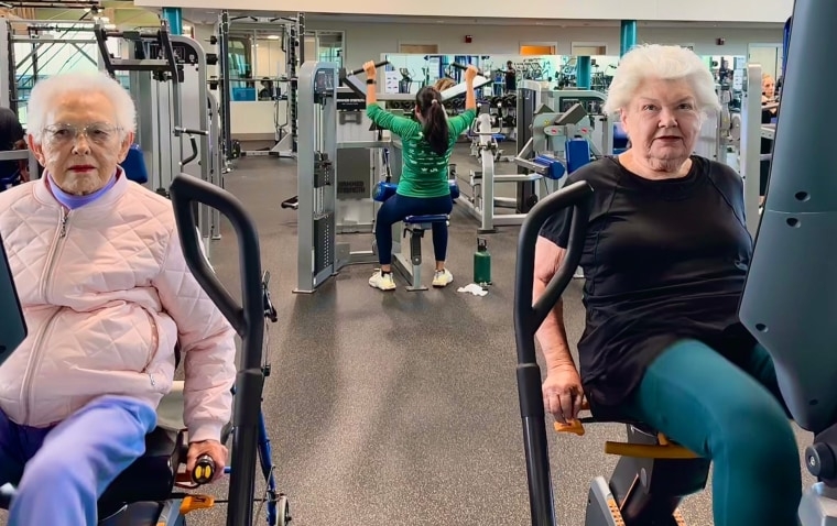 Photo of Ruth Lemay and her daughter using machines at the gym.