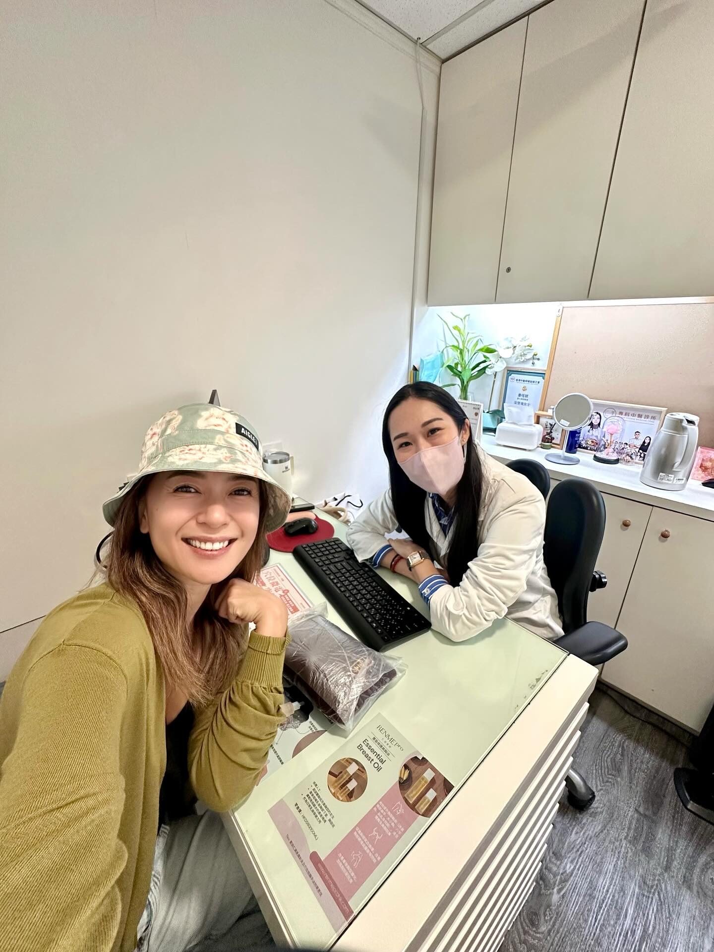 May be an image of 3 people, people studying, hat and text